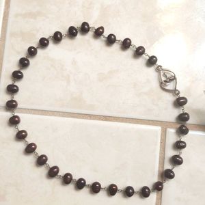 Chocolate pearls on sterling wire necklace.